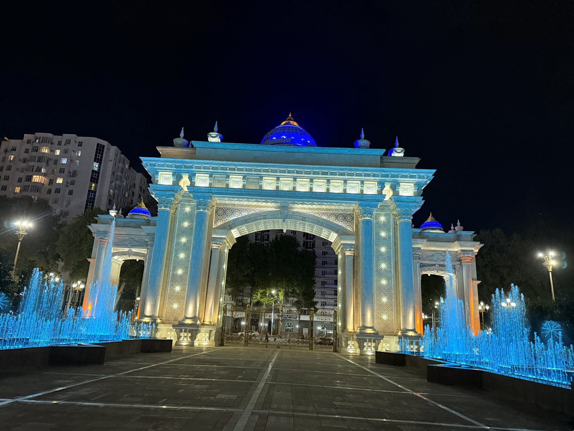 Blue-domed gate at night